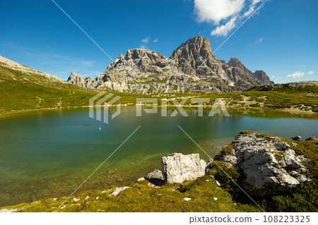 Clear emerald-turquoise pond water in Laghi dei piani area Clear emerald-turquoise pond water in Laghi dei piani area 108223325