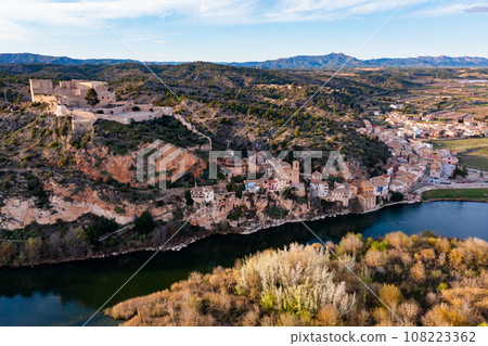 Catalan town of Miravet on banks of Ebro river, Tarragona, Spain Catalan town of Miravet on banks of Ebro river, Tarragona, Spain 108223362