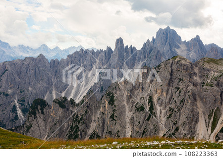 Untrodden places near peaks in Dolomites. Bright sunny day in high mountains. Untrodden places near peaks in Dolomites. Bright sunny day in high mountains. 108223363