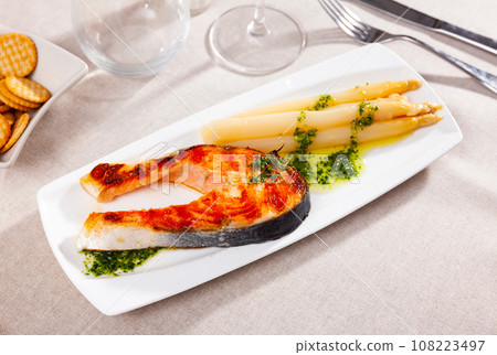 Sliced tasty salmon with asparagus Sliced tasty salmon with asparagus 108223497