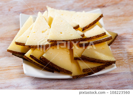 Sliced ripened semi-hard cheese Sliced ripened semi-hard cheese 108223560