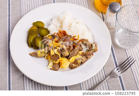 Top view white ceramic plate of flavored omelet with rabbit liver with rice and pickles 108223795