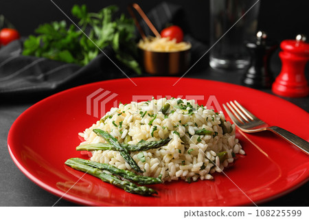 Delicious risotto with asparagus in plate, closeup Delicious risotto with asparagus in plate, closeup 108225599