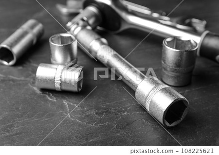Auto mechanic's tools on grey background, closeup Auto mechanic's tools on grey background, closeup 108225621