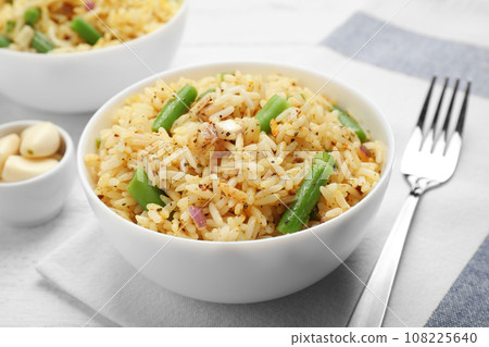 Tasty rice pilaf with vegetables on table Tasty rice pilaf with vegetables on table 108225640