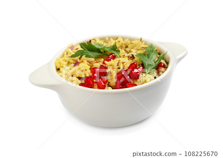 Tasty rice pilaf with pomegranate grains and parsley isolated on white 108225670