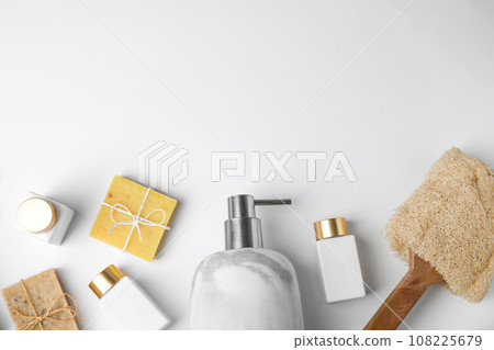 Flat lay composition with marble soap dispenser on white background. Space for text 108225679
