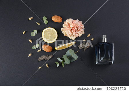 Flat lay composition with bottle of perfume on black background 108225710