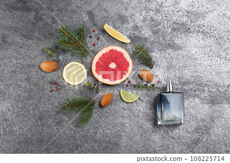 Flat lay composition with bottle of perfume on grey background 108225714
