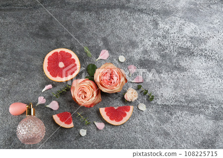 Flat lay composition with bottle of perfume on grey background 108225715