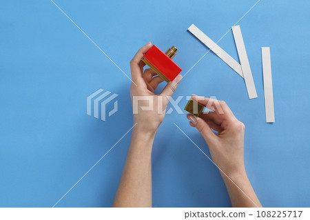 Man with bottle of perfume Stock Photo by ©belchonock 177211714