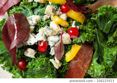 Tasty fresh kale salad as background, closeup 108225913