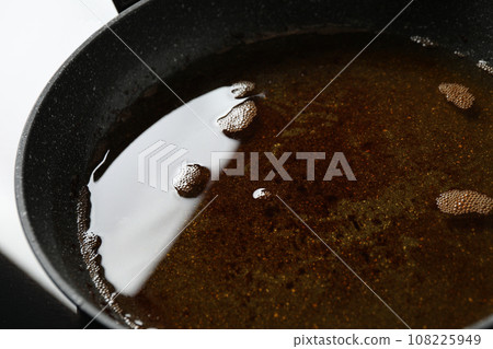 Used cooking oil in frying pan, closeup Used cooking oil in frying pan, closeup 108225949