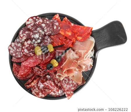 Slate plate with prosciutto and other delicacies isolated on white, top view 108226222