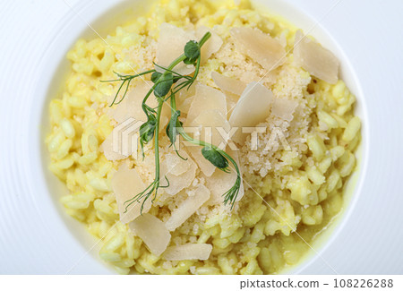 Delicious risotto with cheese in plate, closeup Delicious risotto with cheese in plate, closeup 108226288