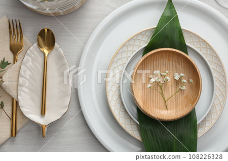 Elegant festive setting on white wooden table, flat lay Elegant festive setting on white wooden table, flat lay 108226328