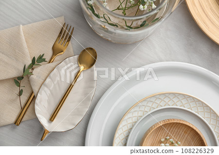 Elegant festive setting on white wooden table, flat lay Elegant festive setting on white wooden table, flat lay 108226329