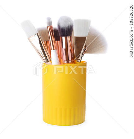 Set of professional makeup brushes in holder isolated on white 108226520