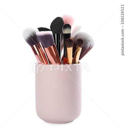 Set of professional makeup brushes in holder isolated on white 108226521