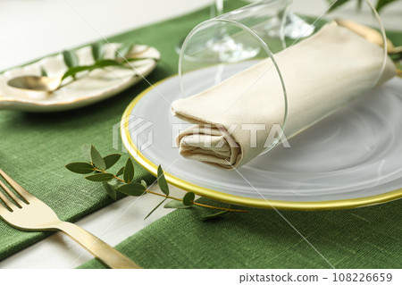 Stylish tableware with leaves on table. Festive setting 108226659