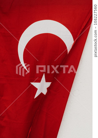 Turkish flag. Turkish flag on the background of the wall. Turkish symbol. Muslim Flag Turkish flag. Turkish flag on the background of the wall. Turkish symbol. Muslim Flag 108227560