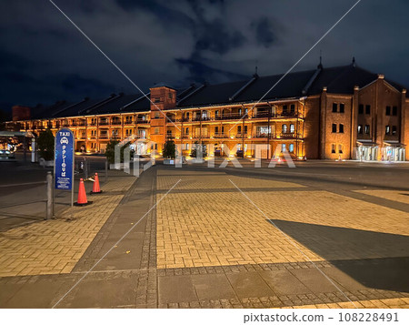 Night view of red brick warehouse 108228491