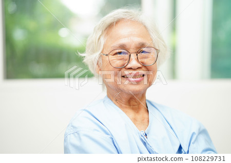 Asian senior woman wearing eyeglasses or vision glasses at home care service. Asian senior woman wearing eyeglasses or vision glasses at home care service. 108229731