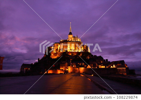 Mont Saint-Michel, a world cultural heritage monastery located on a small island at dusk in the Bay of Saint-Malo in the Normandy region of France Mont Saint-Michel, a world cultural heritage monastery located on a small island at dusk in the Bay of Saint-Malo in the Normandy region of France 108229874