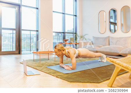 caucasian woman attending online yoga lesson during virus pandemic 108230994