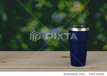 Stainless steel thermos tumbler cup cold mug on top wood with green leaf bokeh background. 3d render. Stainless steel thermos tumbler cup cold mug on top wood with green leaf bokeh background. 3d render. 108232082