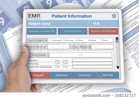 Medical records manual being opened with medical record folden behide. Medical records manual being opened with medical record folden behide. 108232727