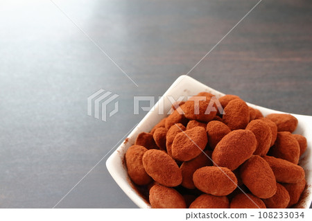 Almond chocolate served on a white plate Almond chocolate served on a white plate 108233034