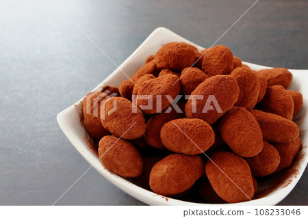 Almond chocolate served on a white plate Almond chocolate served on a white plate 108233046