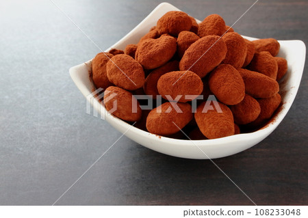 Almond chocolate served on a white plate Almond chocolate served on a white plate 108233048
