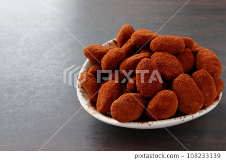 Almond chocolate served on a white plate Almond chocolate served on a white plate 108233139