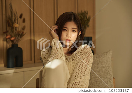 A woman relaxing in the room 108233187