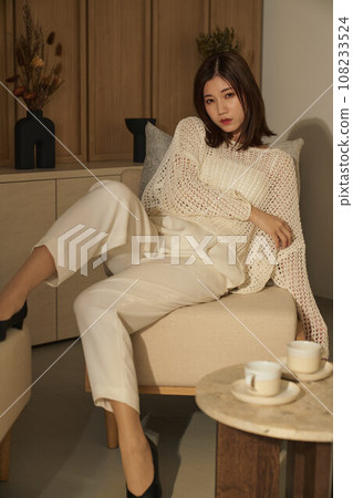 A woman relaxing in the room 108233524