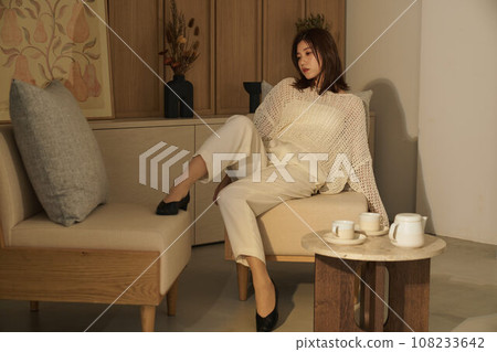 A woman relaxing in the room 108233642