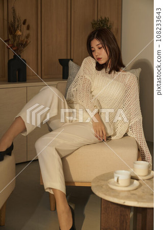 A woman relaxing in the room A woman relaxing in the room 108233643