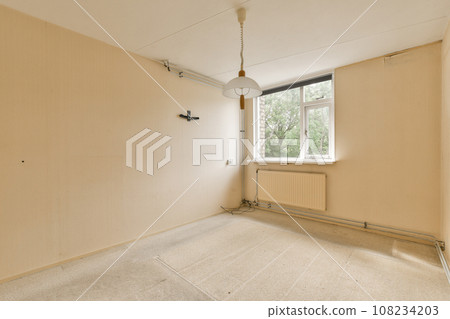 an empty room with no one on the wall or ceiling, but it's very clean and ready for painting an empty room with no one on the wall or ceiling, but it's very clean and ready for painting 108234203