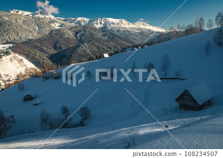 Winter landscape with snow covered slopes and high mountains Winter landscape with snow covered slopes and high mountains 108234507