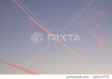 red contrail and sunset sky red contrail and sunset sky 108234775
