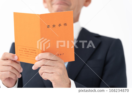Businessman senior with pension notebook 108234870