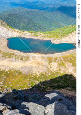 Sightseeing mountain climbing of Mt. Norikura in Nagano Prefecture: Gongen Pond (crater) seen from Kengamine 108236501