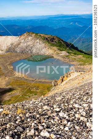 Sightseeing climbing of Mt. Norikura in Nagano Prefecture, Gongen Pond (crater ruins) 108236525