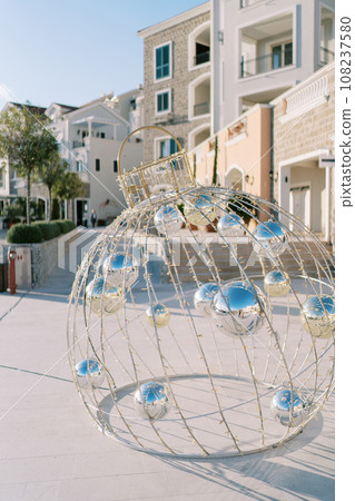 New Year installation in the form of a Christmas ball with mirror spheres inside 108237580