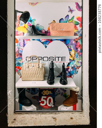 Women winter shoes and handbags in a shop window. Caption: Opposite 108238776
