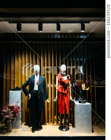 Shop window with classic women and men clothing 108239329