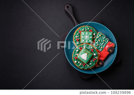 Beautiful Christmas gingerbread cookies on a round ceramic plate 108239896