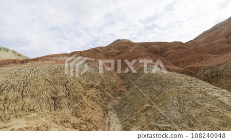 Colorful high mountains and a canyon made of clay Colorful high mountains and a canyon made of clay 108240948